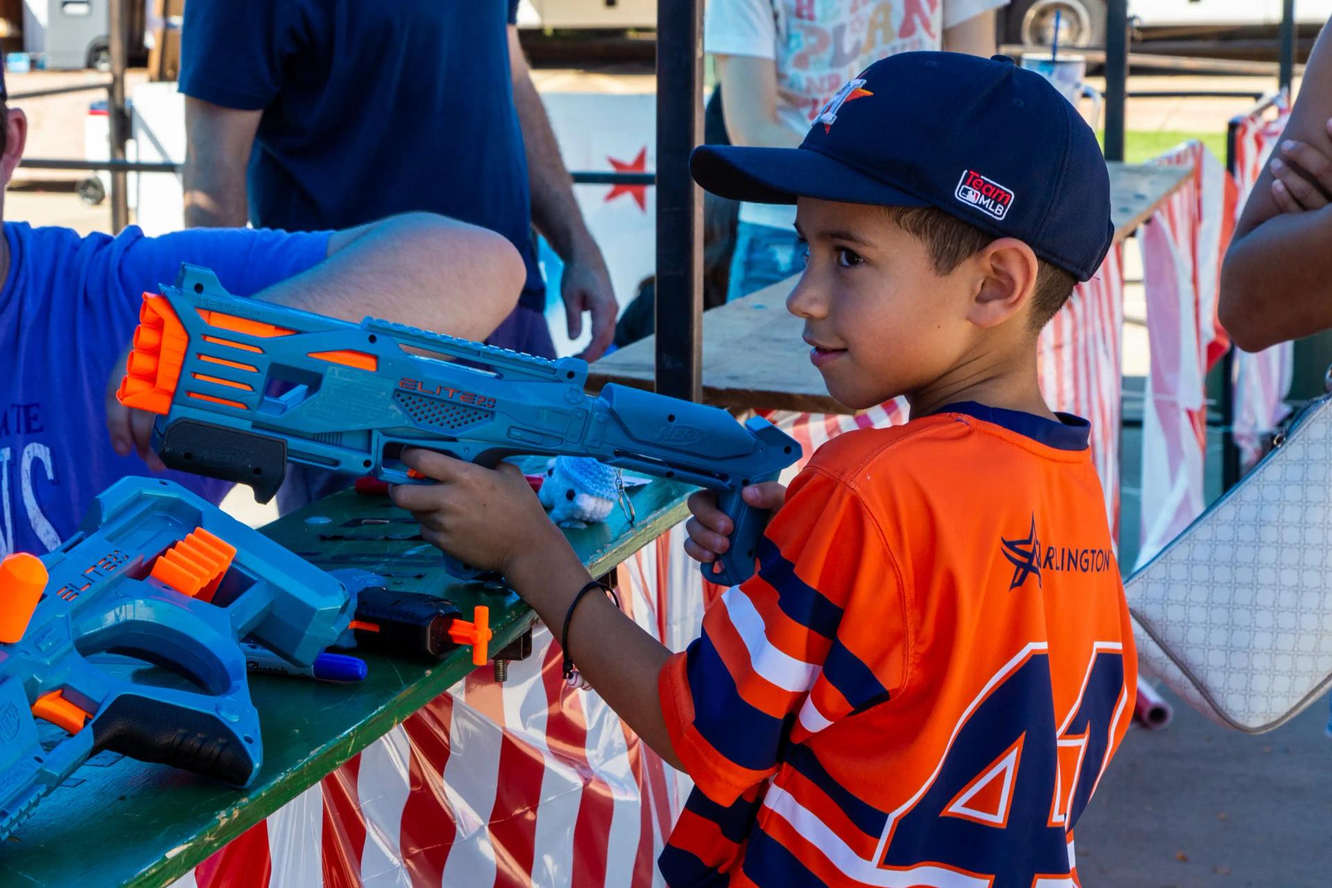 a young boy playing in the Nerf shooting gallery at GorettiFest festival