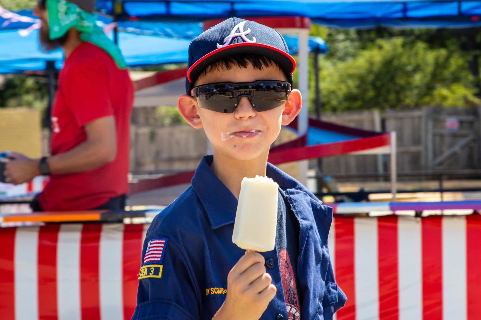 a young boy enjoying frozen treats at GorettiFest festival